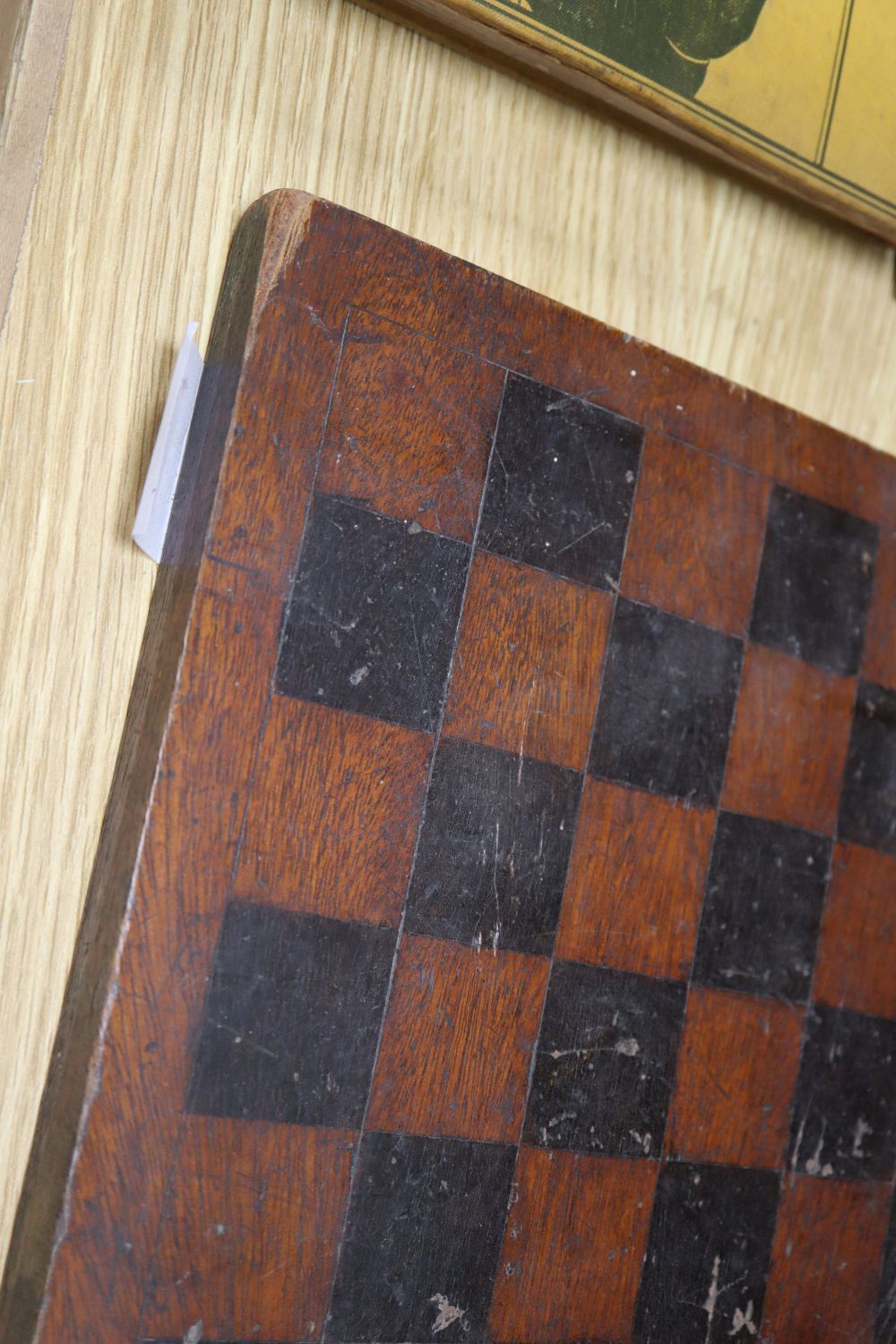A Victorian miniature table, with inlaid top and a chessboard, 34cm sq.